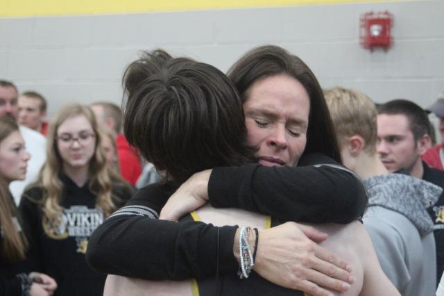 Viking Brady Ortner gets a hug from his mom Laurie after will the 126-pound District title Saturday.
