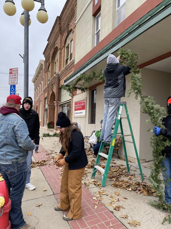 Clayton McKenna, Chase Rippel, Ashlee Thomas, and Matthew Bookmeier made up a group that tackled jobs at the businesses near the courthouse.