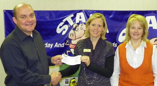 Jon Kremer & Dana Eldred of US Bank present $5,000 check to JA's Barb Rawson (center) on Monday.