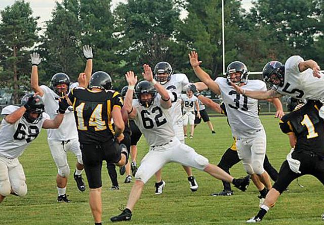 Jay White punts for the VS Alumni team in July.