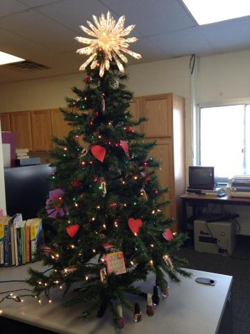 The Jeannine Tree honors the many years that Ms. Slezak decorated the VSMS library.