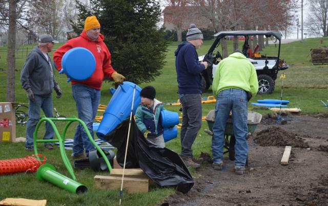 Lincoln brought his dad Colman Silbernagel to help construct playground equipment at Kiwanis Park