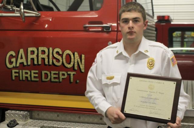 Garrison Firefighter Eric Kakac was honored for saving a life after a car accident in 2009.