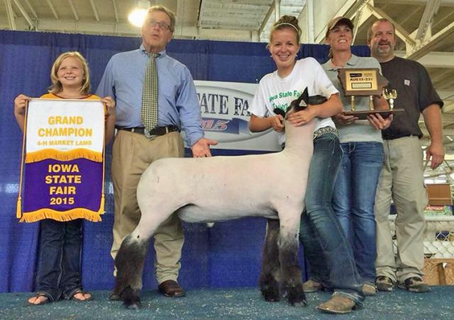 Shelby Karr with the judge & her family: Mike, Chris and sister Ellie, & her State Champion lamb.