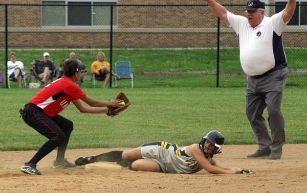 Katie Henderson slides in safely under the tag for one of her three steals Saturday.