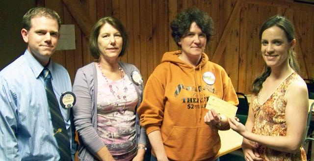 Kiwanis Tom Lindauer, Michelle Schoonover & Ashlyn Christensen give check to Palace's Marcy Horst.