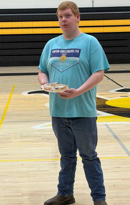 Senior Braedon Hepker showcasing a plate of Kolaches. 