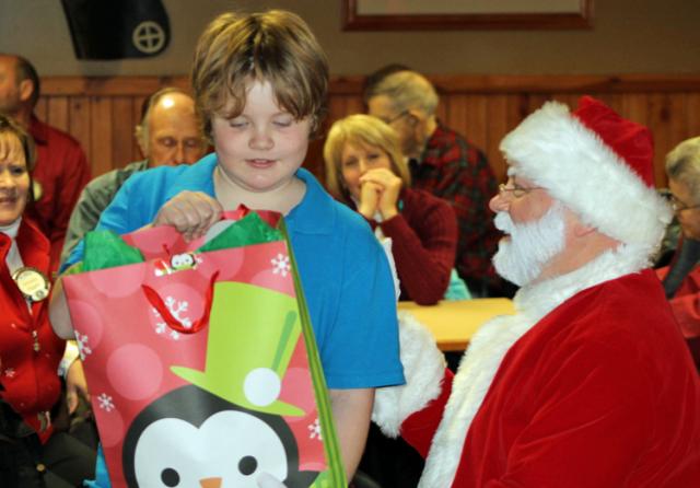 Santa joined the Kiwanis on Tuesday to share Christmas with several Tilford students.