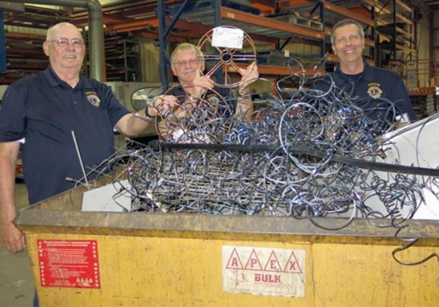 Roger Uthoff, Rick Ohrt and Pat Lyons are among the Lions working on the metal recycling project.