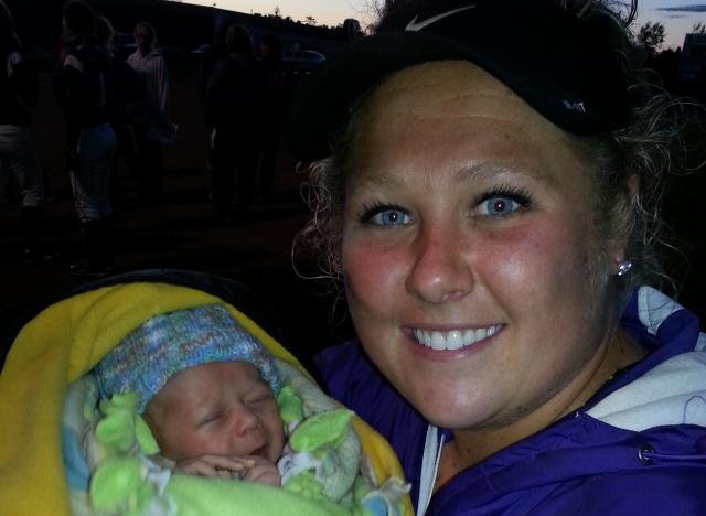 Coach Liz Hill holds her youngest #1 fan, nephew Kalen Scott Hill, son of Ryan & Lena.