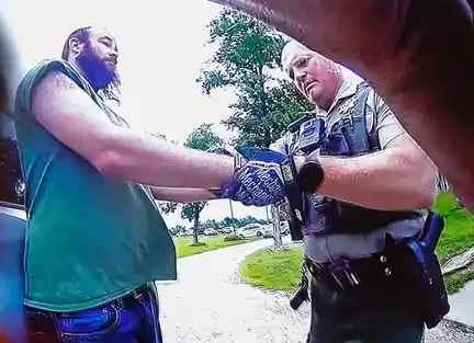 Article Thumbnail. Truesdell being handcuffed and arrested at the scene of the murders. 