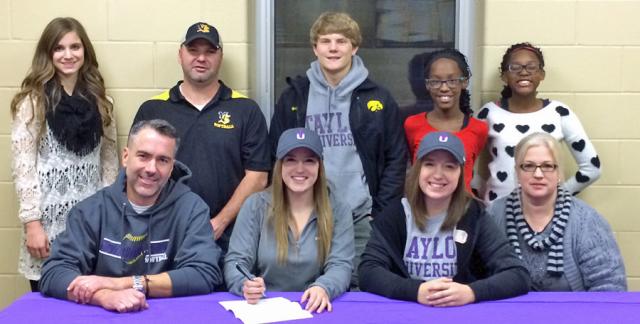 Lyndsey Cornell, joined by family and sister Maddie, will play softball for Taylor University.