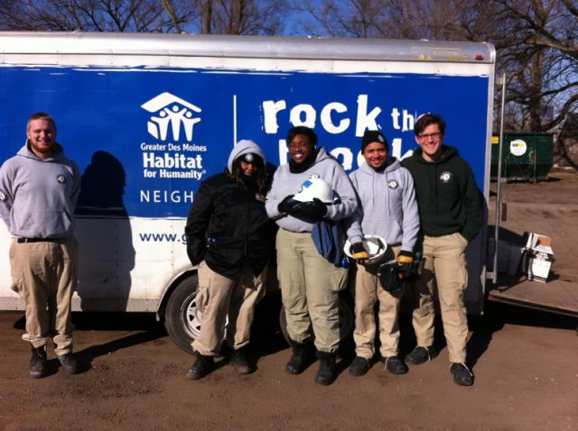 Maple 4 poses in front of a Rock the Block trailer.