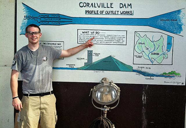 Sean McGinnis showing a display of the Coralville Lake Dam.