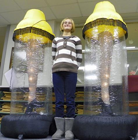 Madyson Rule poses with lamps that will help raise funds for her trip to Europe in June of 2012.