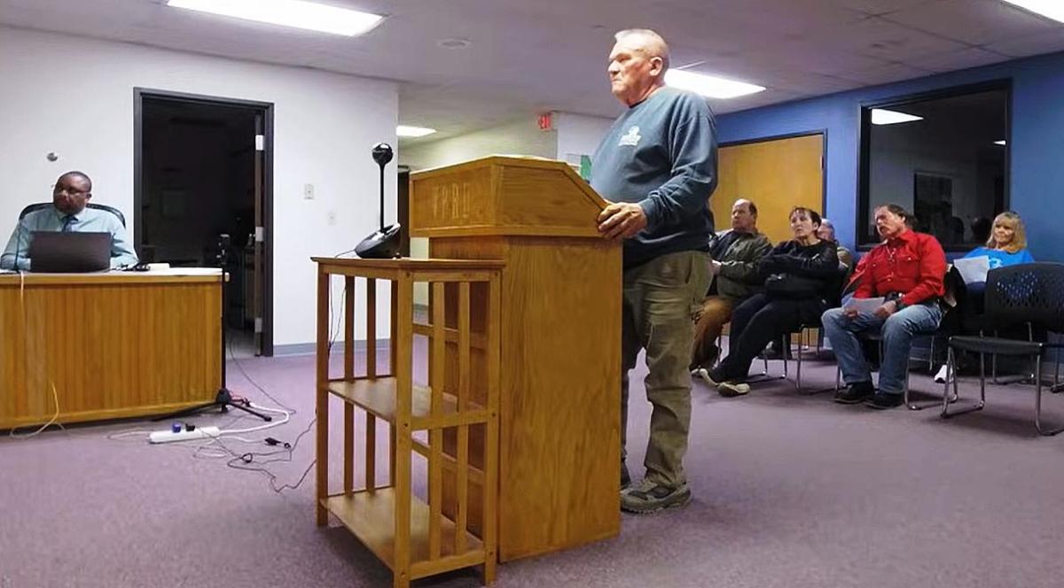 Marvin Roster discusses with the council the snafu concerning his building permit and restitution