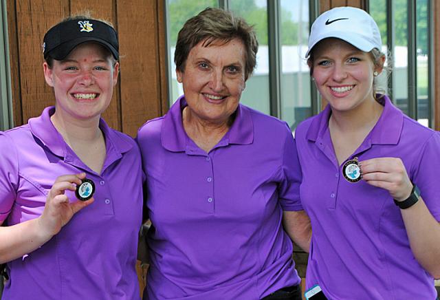 Coach Woodhouse congratulates Olivia Walker, left, and Lauren Tandy, who led V-S at S. Tama.