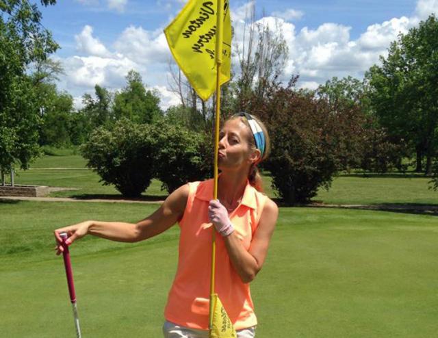 Melanie Blais celebrates her first-ever hole in one Tuesday, at the Vinton Country Club.