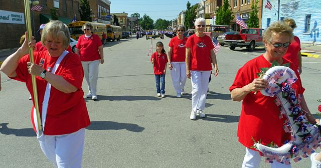 Auxiliary members march in the Memorial Day Parade, en route to the river for the Naval tribute.
