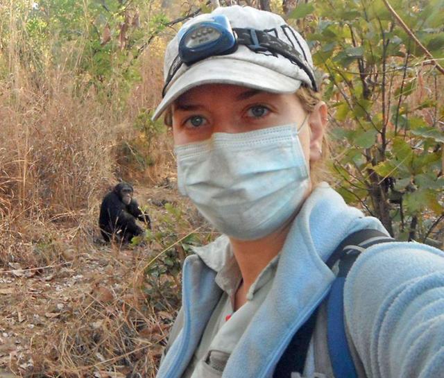 Erin Wessling, granddaughter of Ralph and Marge, with a chimp named Mike in Senegal.