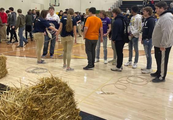 Annabelle Newton and Bailey Weeks taught Vinton Shellsburg students how to rope using hay bales.