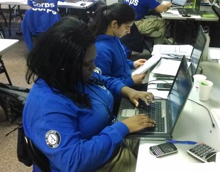 Princenella and Victoria are working their project worksheets in the Springfield office.