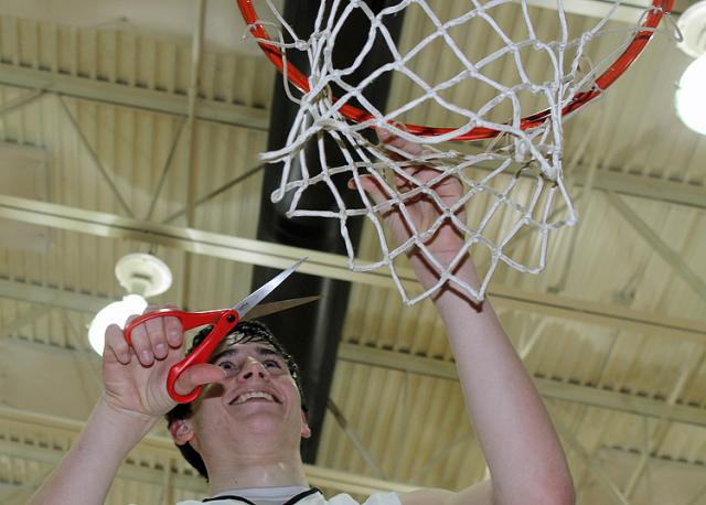 WaMaC Conference Champions: Viking scoring leader Grant Sagan was the first player to cut the net.