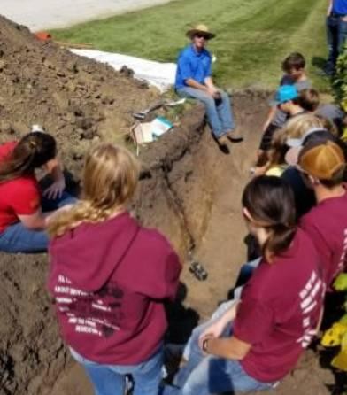 NRCS, Hawkeye Community College, and Iowa State University guide youth through assessing soil quality.