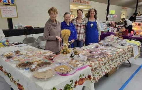 P.EO. members Connie Gill, Dana Jumper, Natalie Moore and Maureen Boddicker at a fundraiser to assist area women