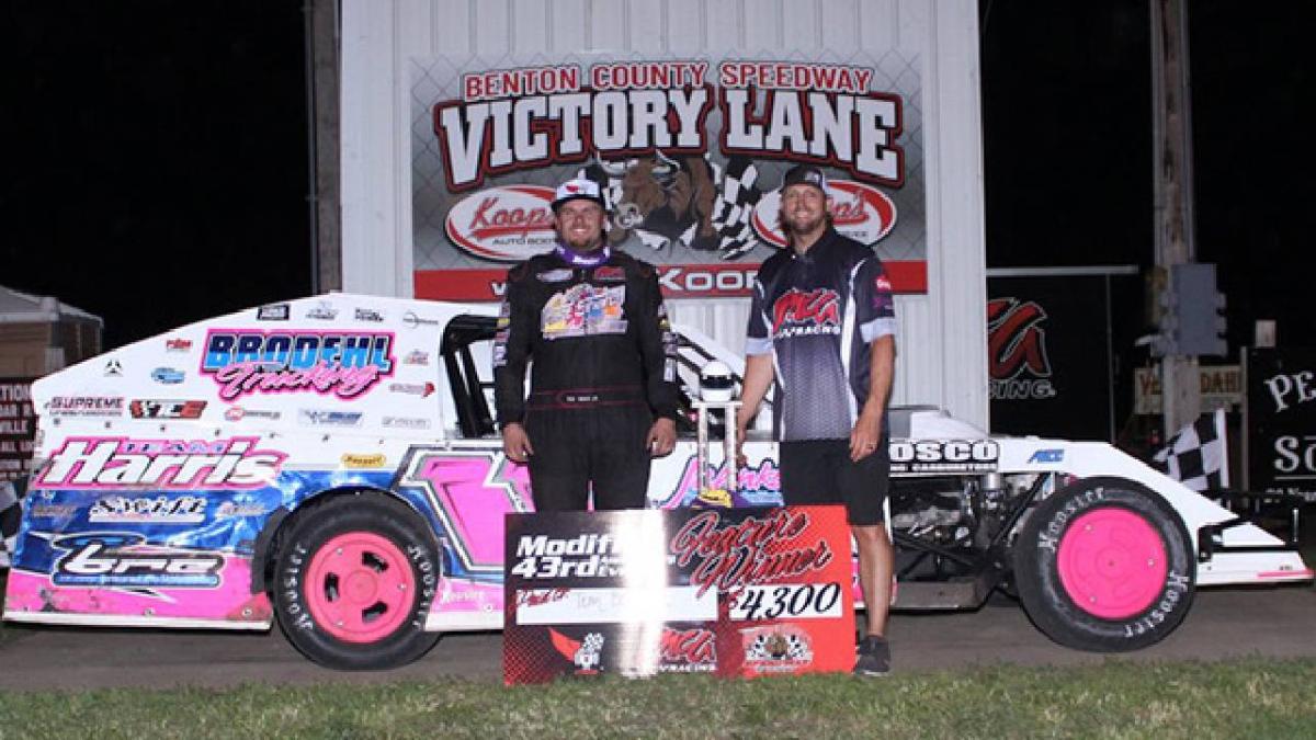 Tom Berry Jr. celebrated another special win at Benton County Speedway on Monday, leading all 43 laps of the 43rd Anniversary main event for Friesen Performance IMCA Modifieds and going home with $4,343. He is pictured with IMCA President Brett Root. (Pho