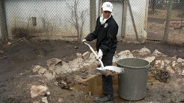 Oak 1 member Andrew Kuka from Paterson, N.J. shoveling gravel.