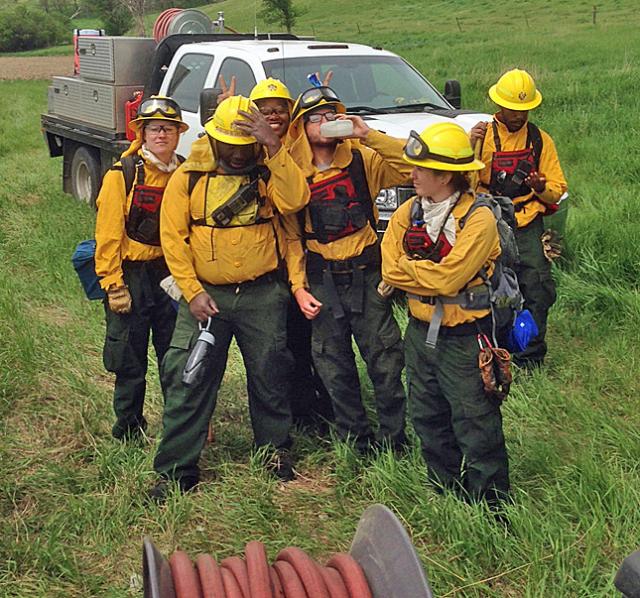 Oak 4 celebrates as a team after a successful burn in Plymouth County.