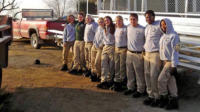 Oak 3 posing before they brought an ironclad bench to a Vinton baseball field.