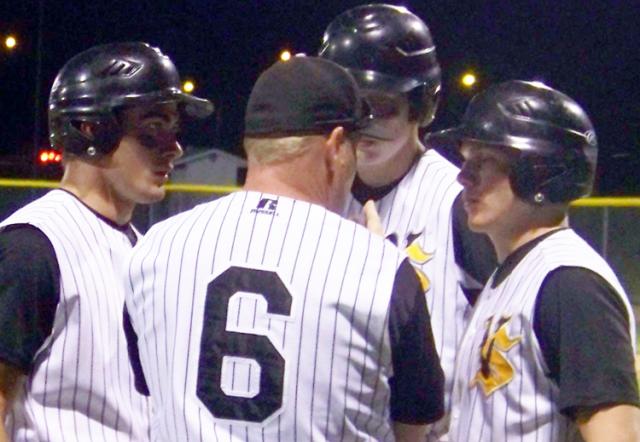 Coach Jim Struve talks offense with Clint Ferguson, Carson Struve and Matt DeVries vs. Marion.
