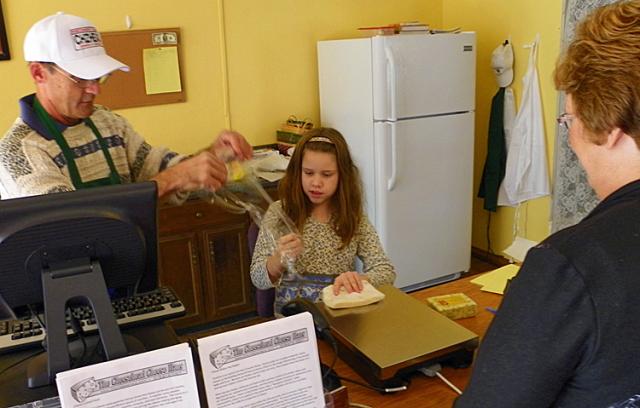Bob Shultis and daughter Julia help serve customers at the Cheesehead Cheese Haus.