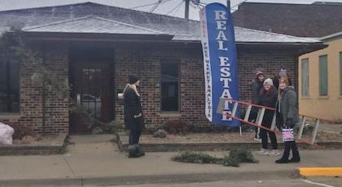 It's time to put the Christmas decorations away, these elves were helping downtown Saturday