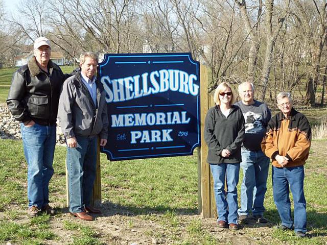 Dan Pence, Jay Herman, Shawnell Blattler, Marvin Bergen and Marshall White pose near new park sign.