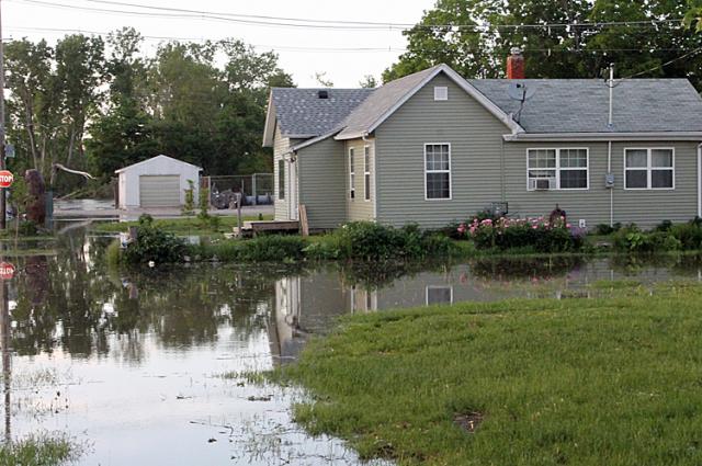 The home of Brian and Jennifer Parr was one of several in the path of rising flood waters Friday.