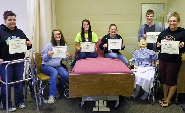 Alyssa, Brea, Olivia, Jaeger, Rickey and Abby, with 'Stanley,' their artificial patient.