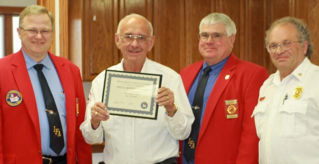 Al Esch, IFA 1st VP; Paul Schellhase; Jack Runge, IFA past president & Garrison Chief Steve Meyer.