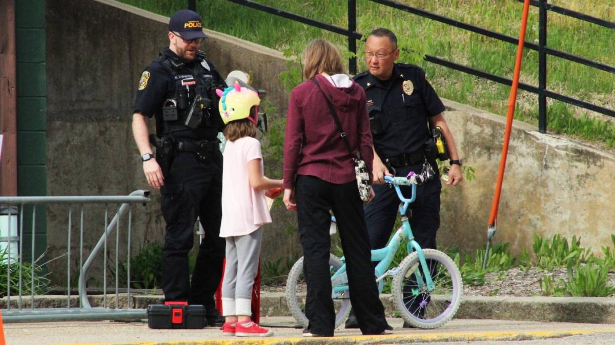 The Vinton Police officers lent a hand as part of the Bike Rodeo. VPD Chief Ted Paxton visits with the young rider. Click to read article