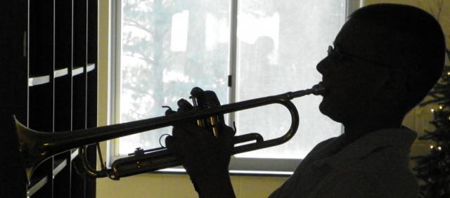 Zach Uthoff plays taps to honor the USS Arizona and those lost during attack on Pearl Harbor.
