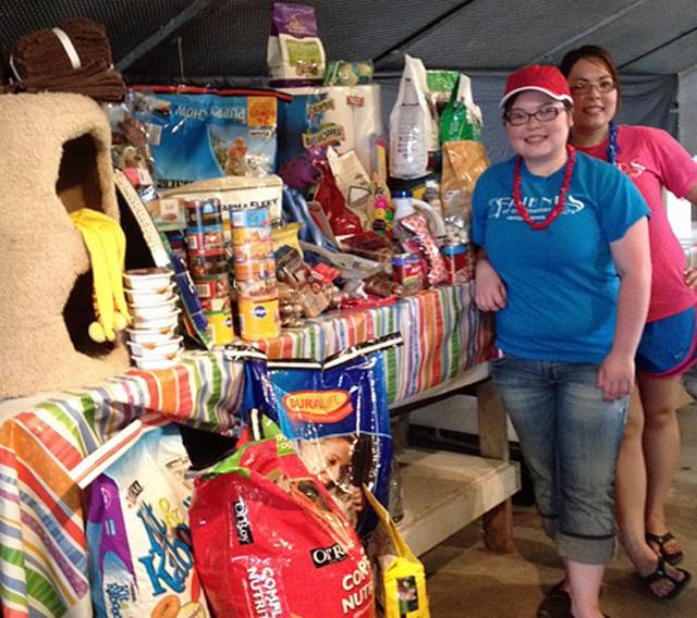 Volunteers from Friends of the Shelter collected donations from race fans at BC Speedway July 22.