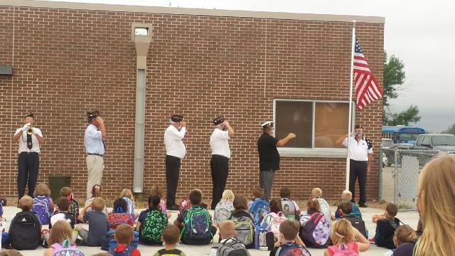 The Shellsburg Legion continues flag raising tradition in spite of a missing flag pole this year