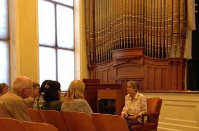 Carolyn Hibbs shares the IBSSS/Ingalls story with visitors from Japan and Australia.