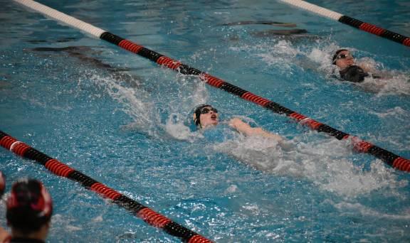 Brie Carolan swimming her 100 Backstroke