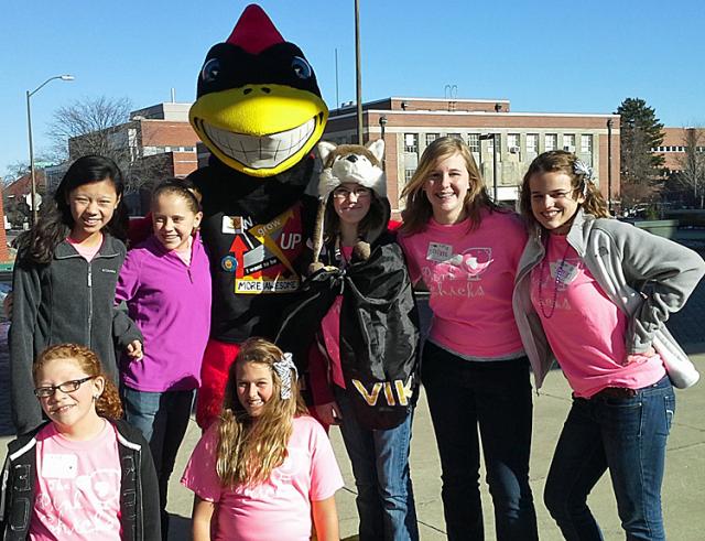 The Pink Chicks pose with Cy at the Lego League event in Ames on Saturday.