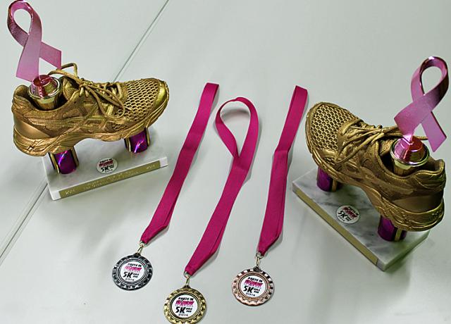 Ashley Hesson created these trophies and medals for the June 27 Party in Pink 5K event.