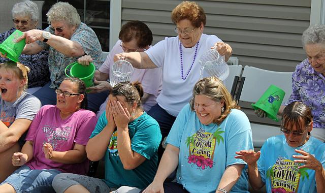 Ice Bucket Challenge: Joyce Pollock drenches Lisa Staab and Carrie Hantz at Windsor Manor.