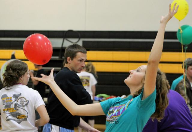 Post Prom, 2014: Lexi Hicok tries to keep two balloons in the air at the same time.